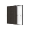 Two solar panels mounted on a frame, showing dark photovoltaic cells and a white back panel behind them