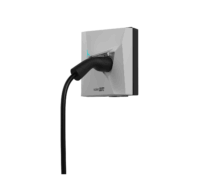 EV charging connector plugged into a wall-mounted SolarEdge charger unit with a black cable extending downward - Solarplaza