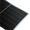 Close-up of a tilted solar panel array outdoors, showing dark photovoltaic cells and a white frame against a blue sky.